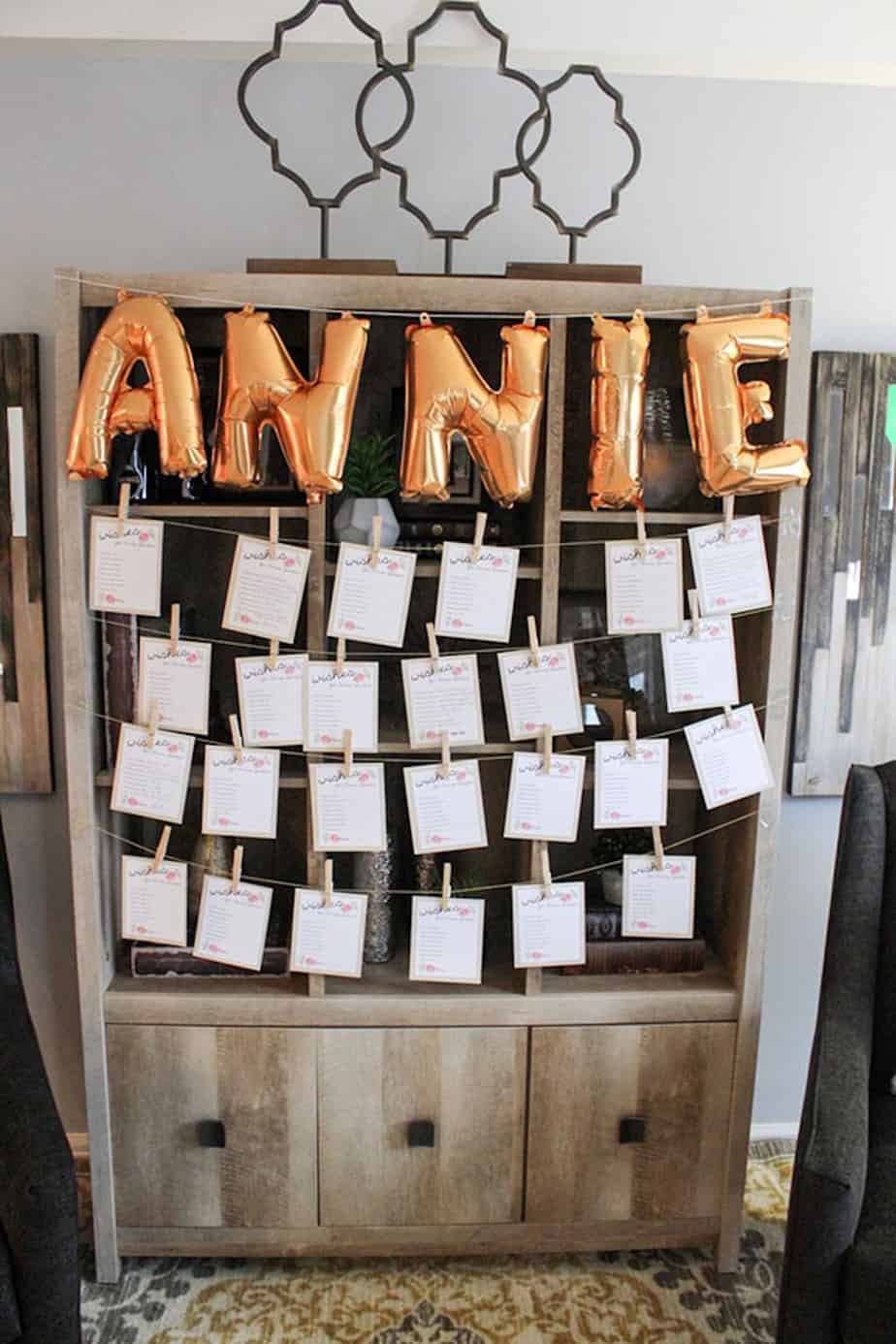 Wish cards hanging on display with balloons spelling out baby's name