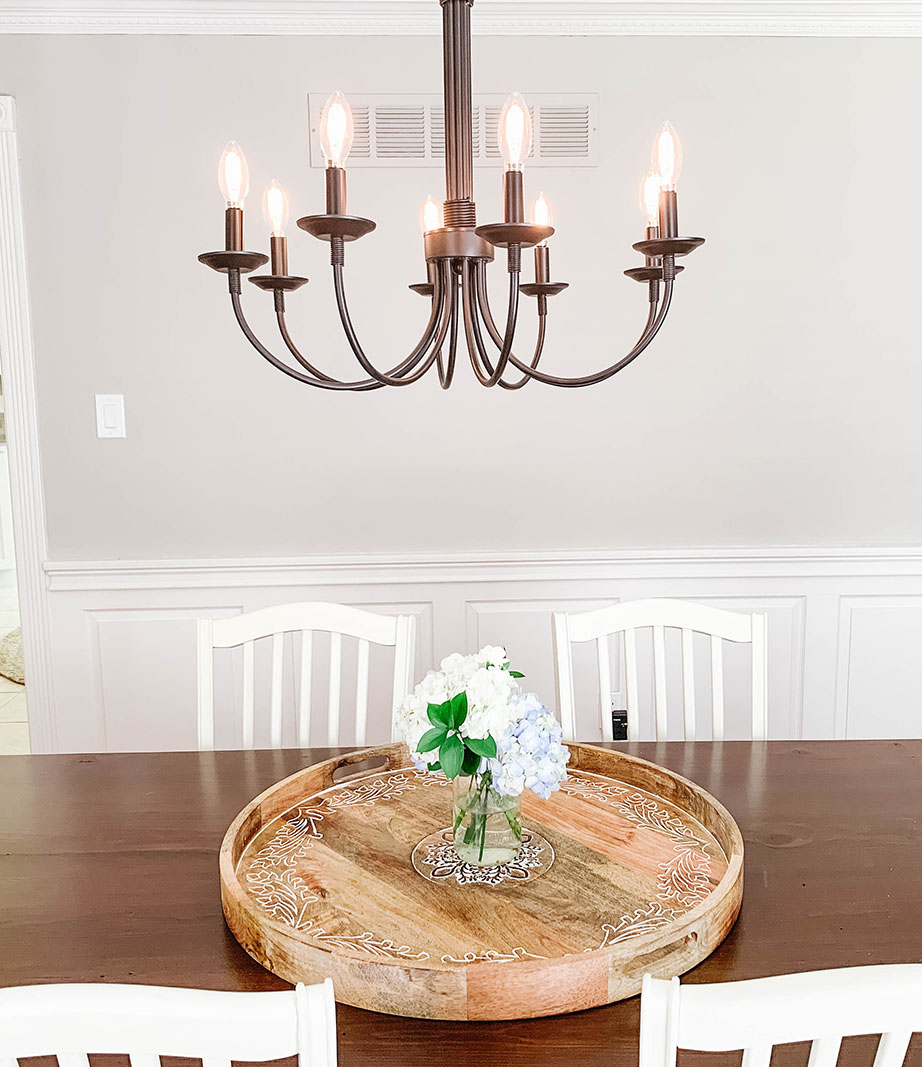 dining room with large wooden table and chandelier hung