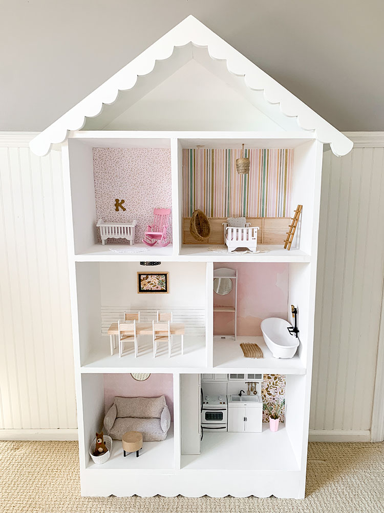 DIY dollhouse makeover project using a thrifted bookshelf