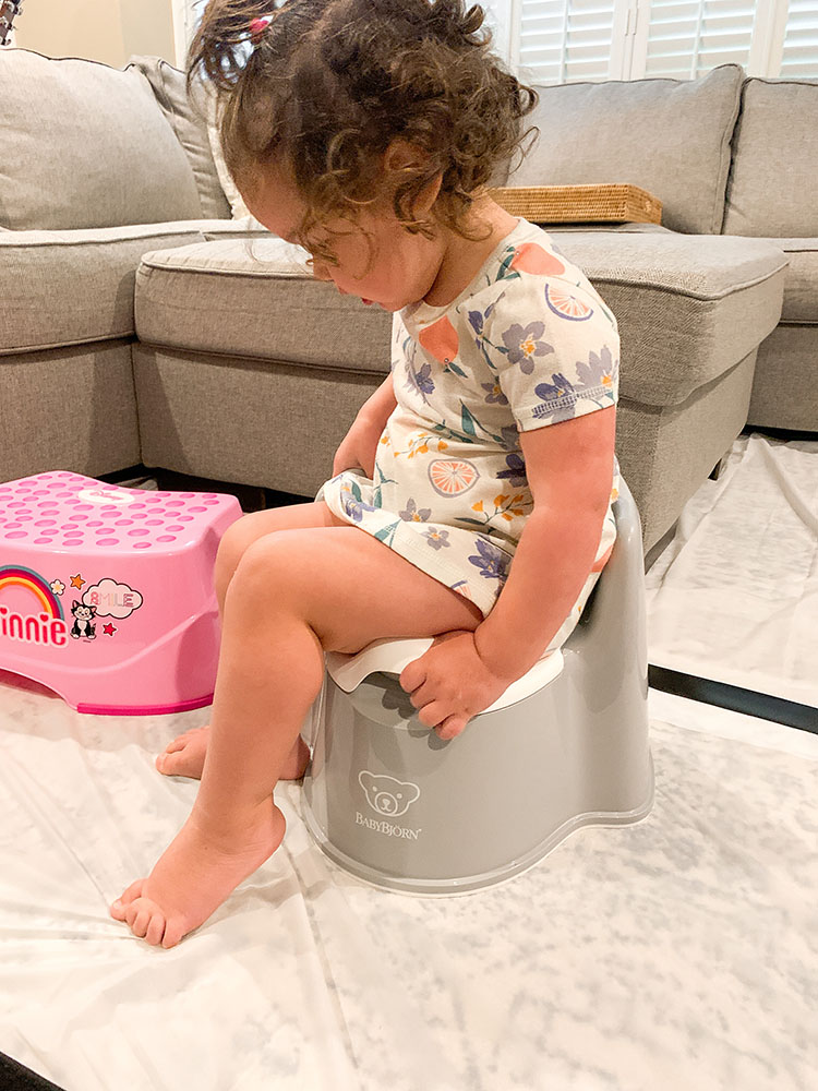 Toddler learning to potty train using the Oh Crap Potty Training Method.