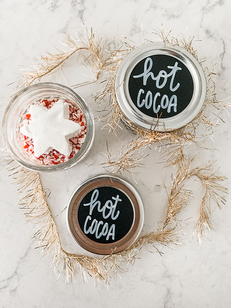 Mini hot cocoa jars filled with cocoa mix and homemade marshmallows