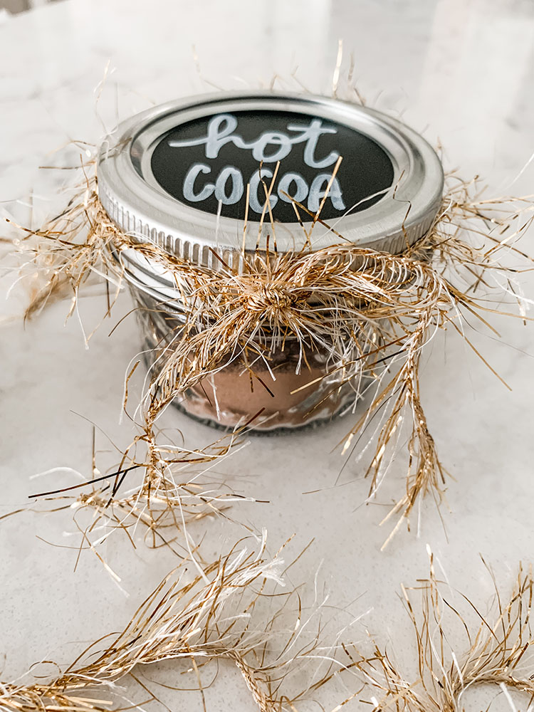 Mini hot cocoa jars filled with cocoa mix and homemade marshmallows