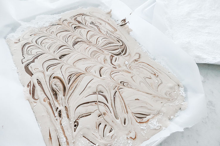 Pan of nutella marshmallows swirled and ready to cut