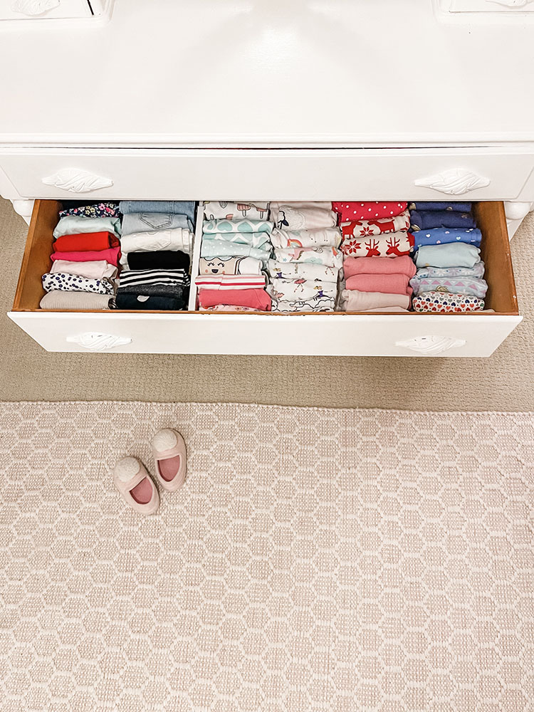 dresser drawer opened showing how clothes are file folded inside