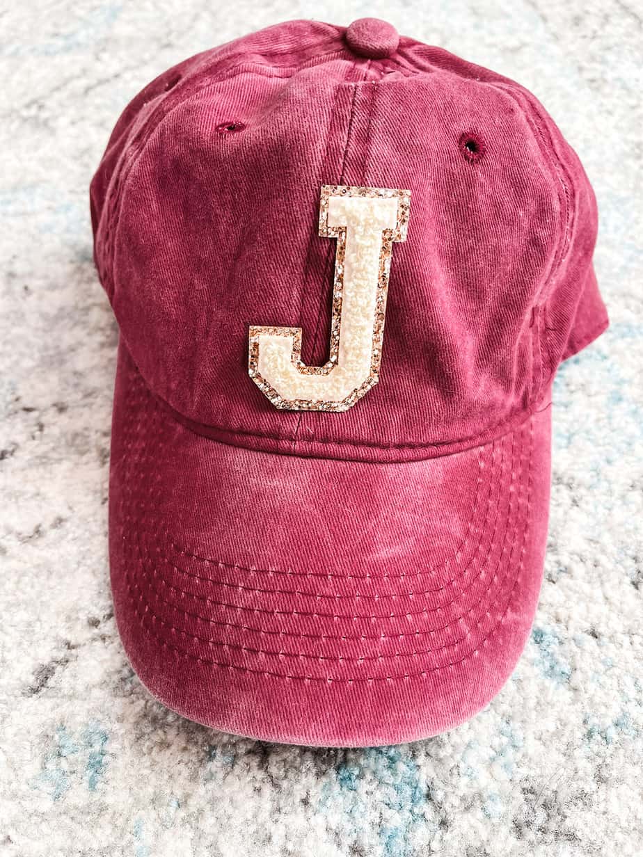 Stoney Clover dupe style hat with letter initial patch.