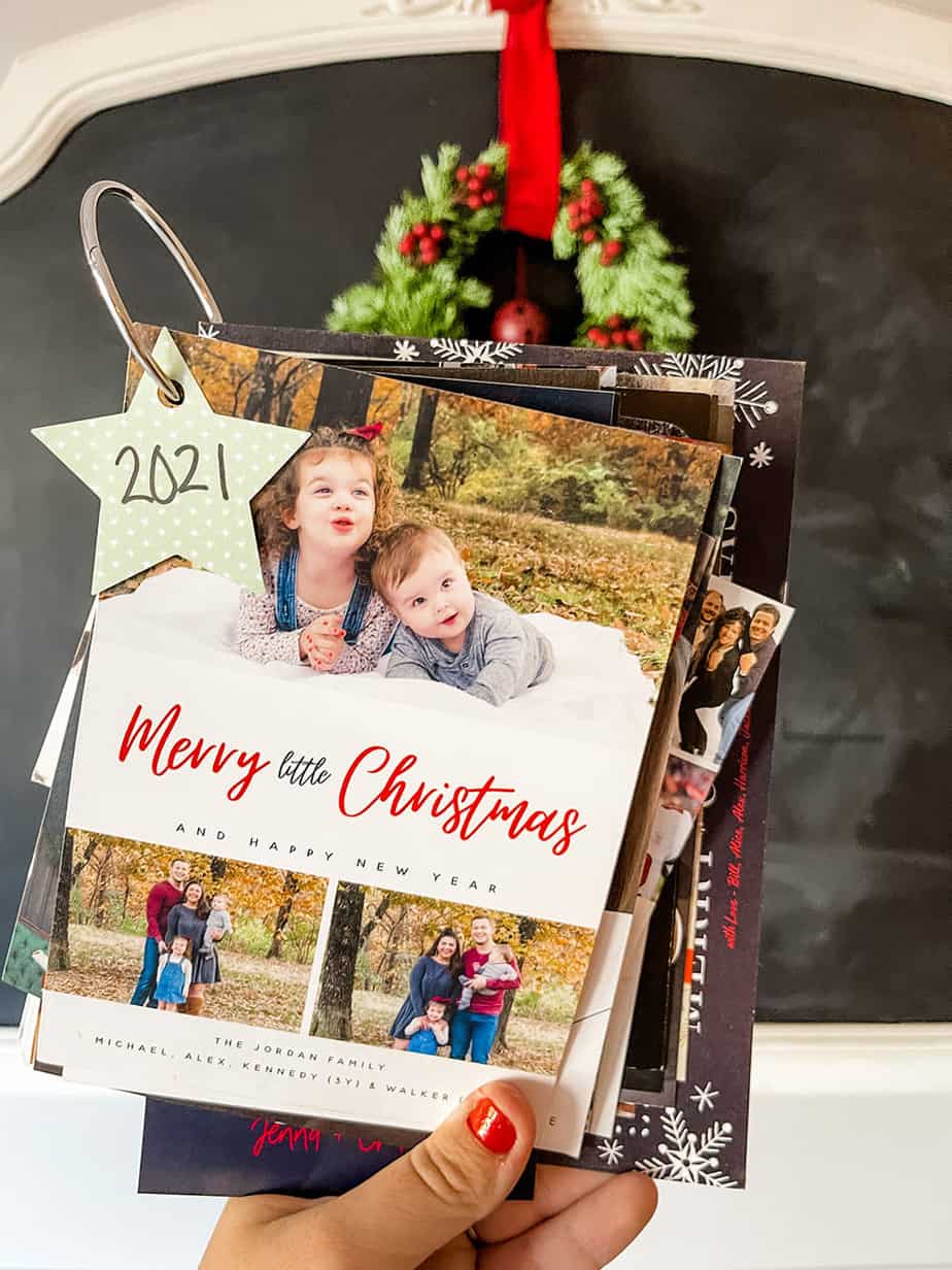 Christmas cards with a hole punched in the top corner and then placed onto a binder ring for easy storage and safe keeping.