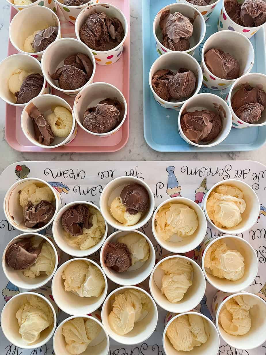 prescooped ice cream into polka dot cups on ice cream trays to serve at a party